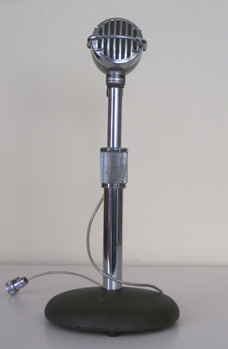 Microphone on a desk stand circa 1950