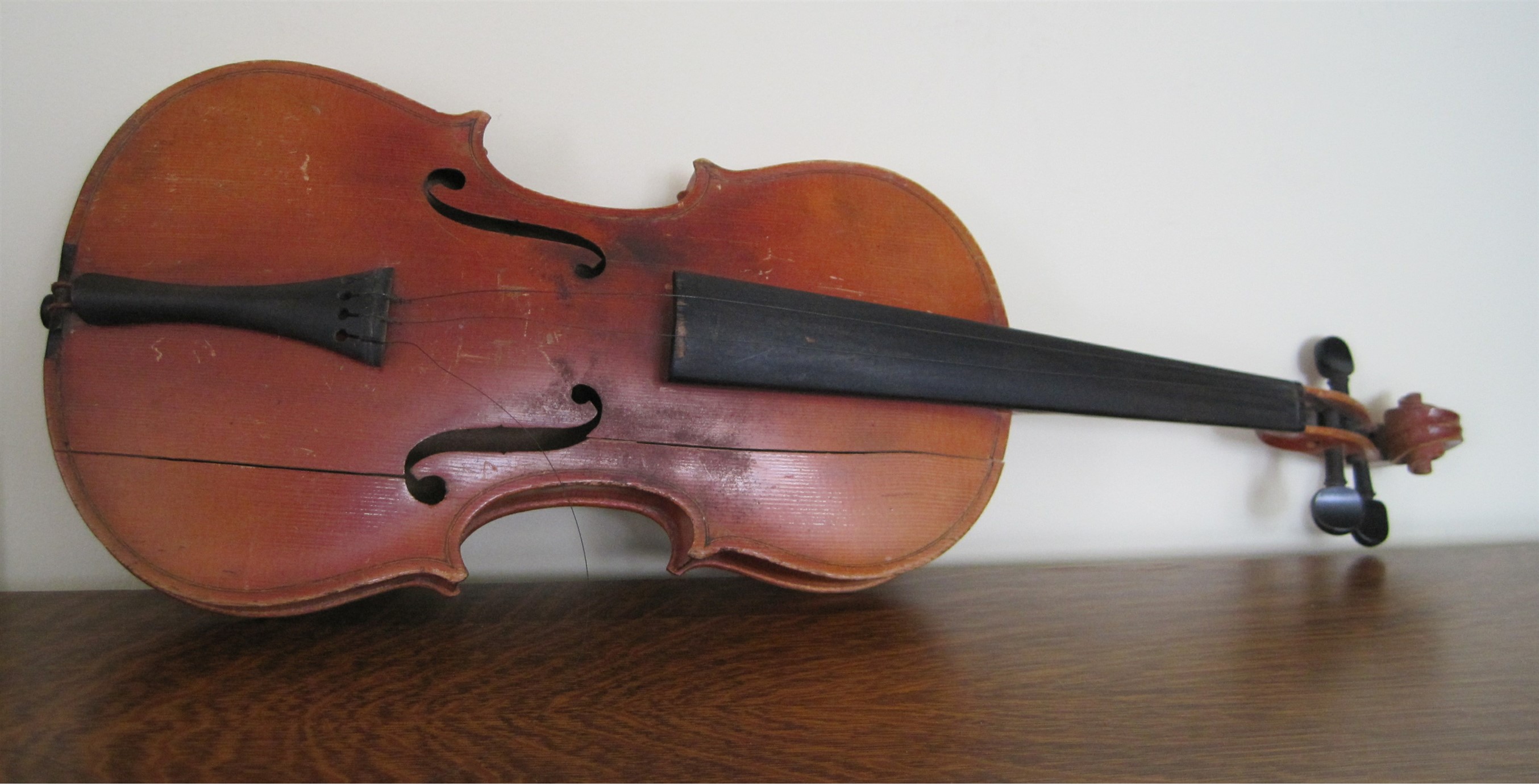Broken Violin lying on its side